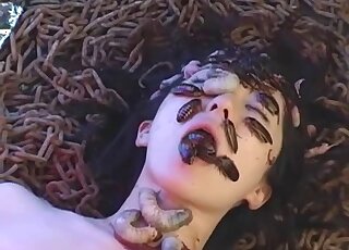 Insect fetish video with a girl eating sexy bugs on a bed of worms