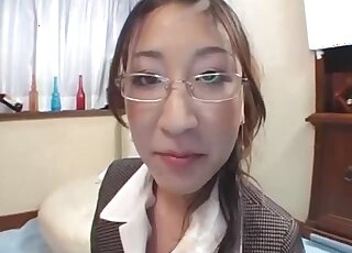 Lazy Labrador gets a blowjob from a Japanese business lady