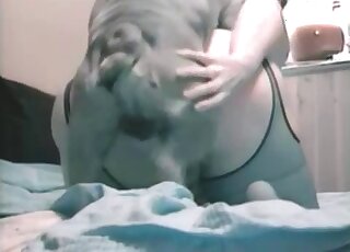 Big ass MILF gets fucked by a dog on all fours in taboo zoophile tape
